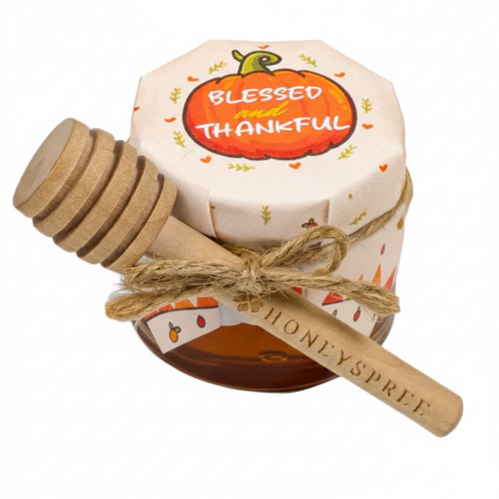 Honey container with wooden dipper featuring 'Blessed and Thankful' text on a white background