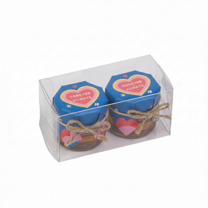 Two small jars with heart-shaped lids labeled 'Forever Always' in a clear packaging box.