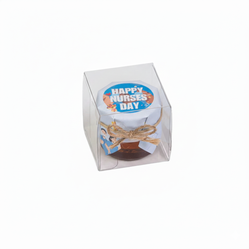 Honey jar in a box with 'Happy Nurses Day' decoration on a white background