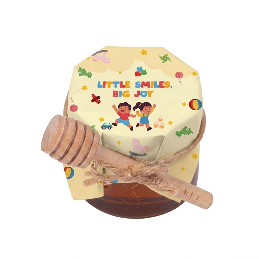 Small honey jar gift with Little Smiles, Big Joy packaging, paired with a wooden honey dipper.
