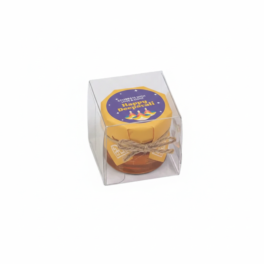 Small round gift item in a clear box with a 'Happy Diwali!' label on a white background