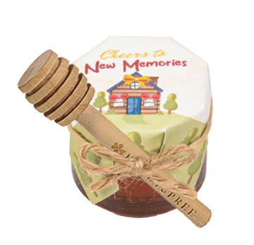 Honey container with dipper featuring a scenic design and text on a white background