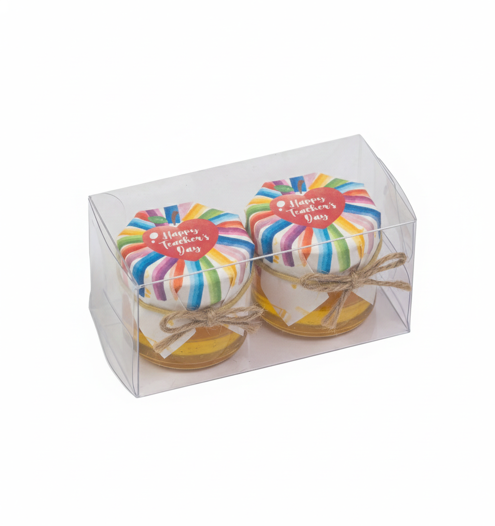 Two rainbow-colored jars in a clear box with 'Happy Teacher's Day' text on a white background.