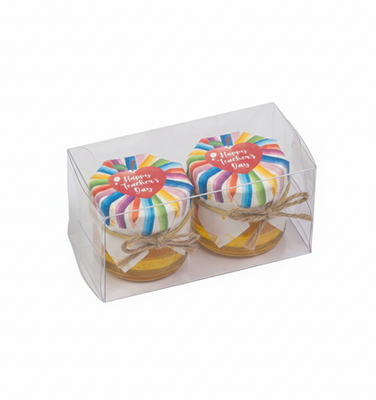 Two rainbow-colored jars in a clear box with 'Happy Teacher's Day' text on a white background.