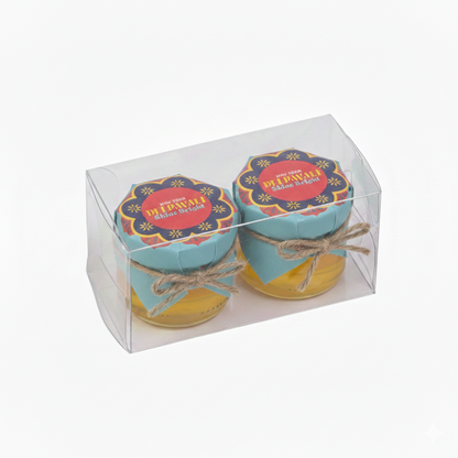 Two small jars with colorful lids in a clear packaging box on a white background