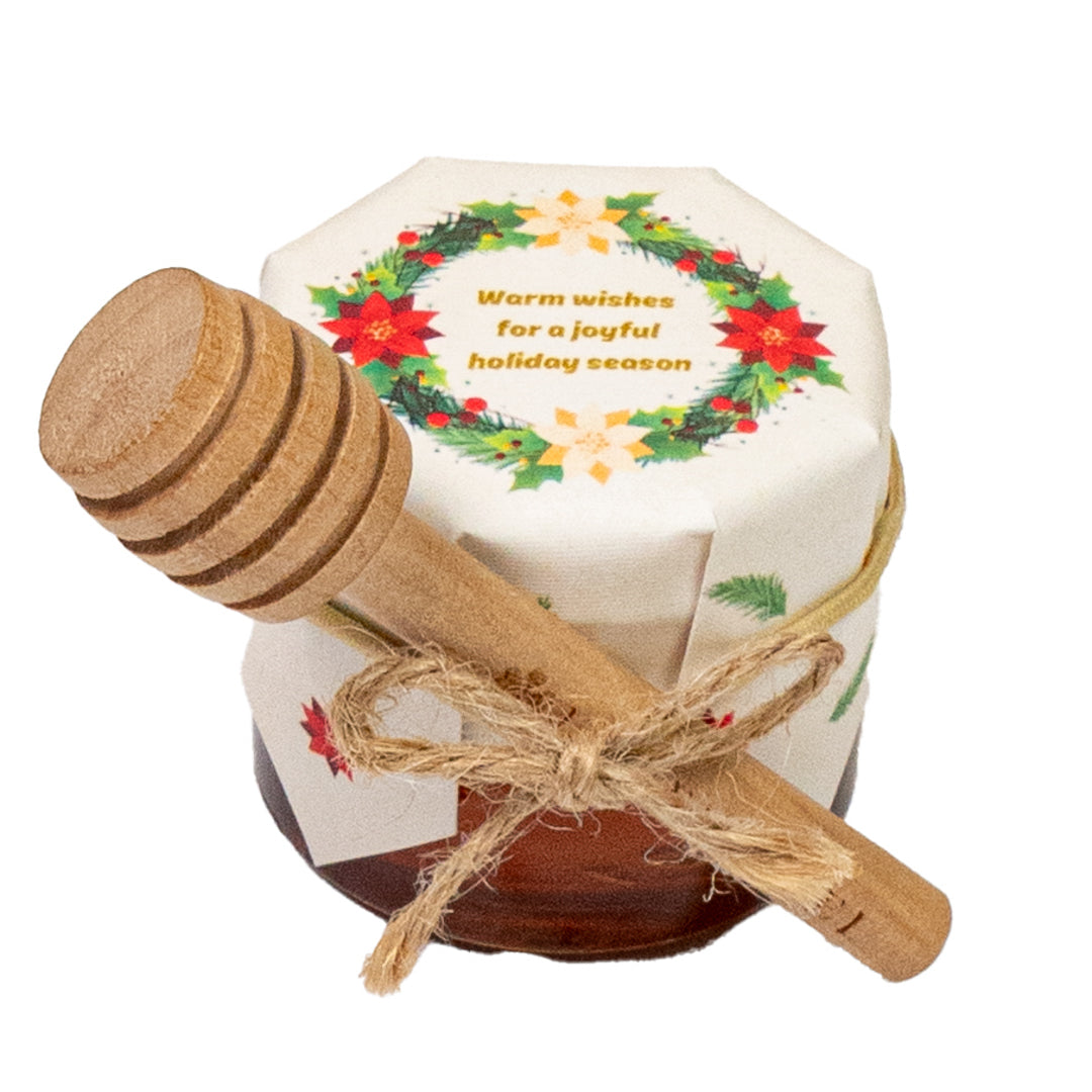 Small hexagonal container with a wooden spoon, featuring a Christmas design and text on a white background.